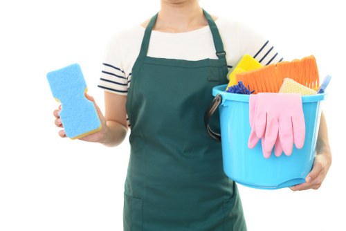 Cleaning technician preparing carpet cleaning equipment safely